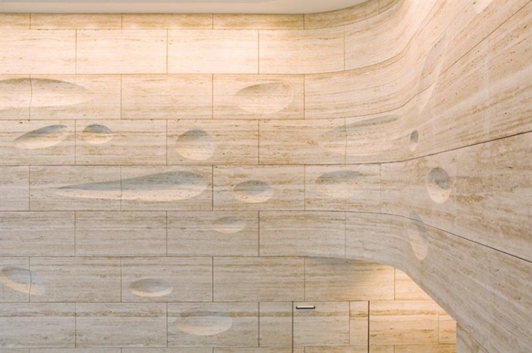 sculpted travertine wall design