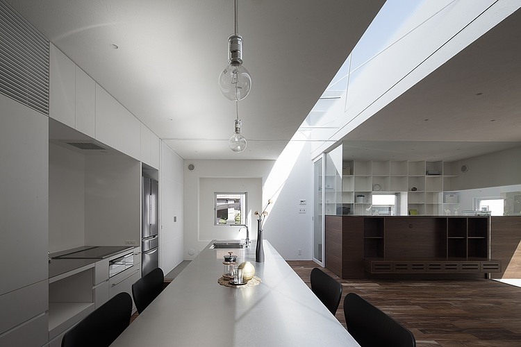 Frame House by Uid Architects & Associates